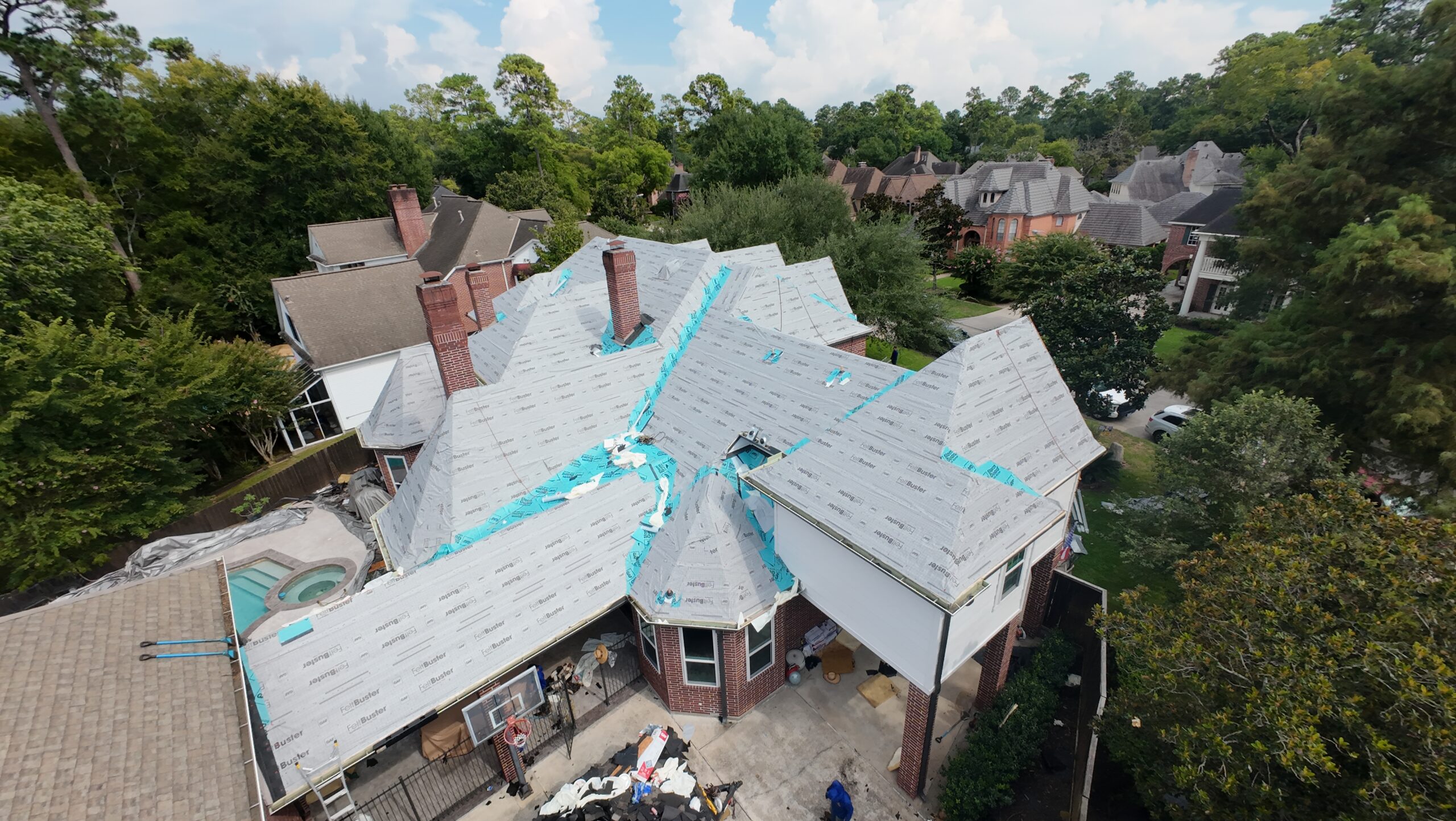 Urena Roofing crew on a residential roof job in Houston, TX